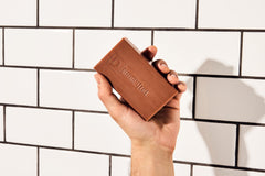 Duke Cannon unwrapped soap being revealed to show gift-ready presentation benefit