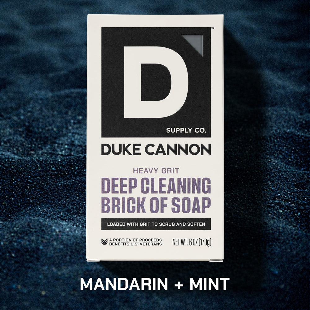 Duke Cannon brick soap next to a ruler, shows durable 6 oz size benefit
