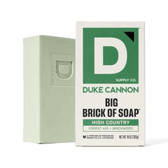 Duke Cannon bar in outdoor shower scene evoking fresh mountain scent benefit