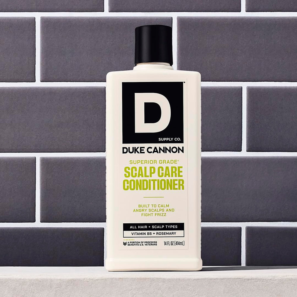 Duke Cannon label close-up with rosemary and arnica callouts, botanical soothing benefit