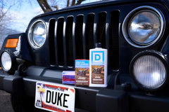 Duke Cannon lifestyle outdoor shower setting evoking rugged scent and suitability for active routines