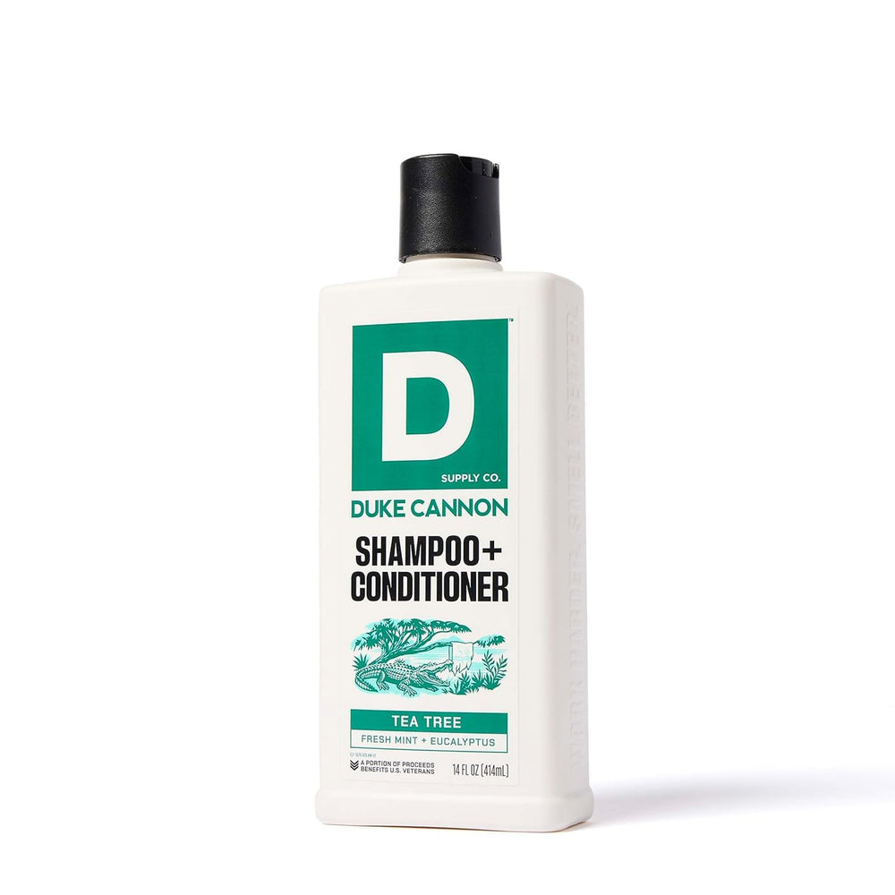 Duke Cannon bottle in hand to show 14 fl oz scale and portability