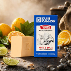 Hand holding Duke Cannon bar to show 10 oz scale and long-lasting benefit