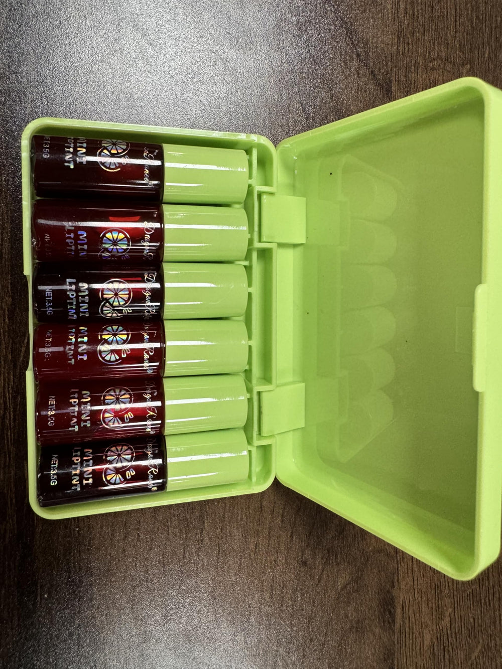 Eakroo lip tints inside a purse illustrating convenient on-the-go touch-ups