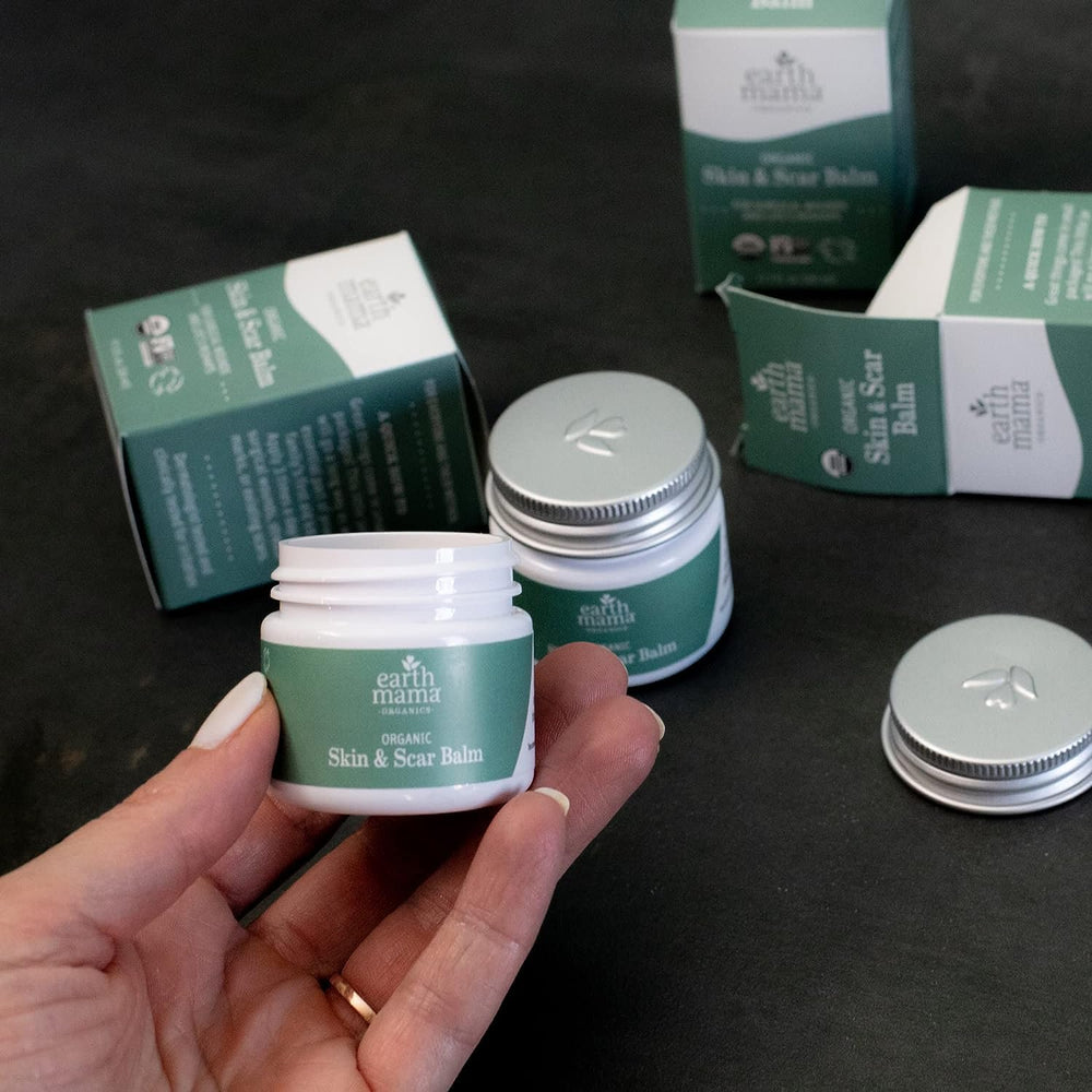 Earth Mama balm on bathroom shelf illustrating daily skincare routine