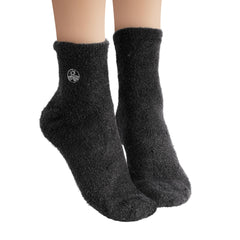 Earth Therapeutics aloe vera socks worn overnight on feet demonstrating deep moisturizing benefit