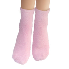 Earth Therapeutics aloe vera socks next to a hand for size comparison and coverage benefit