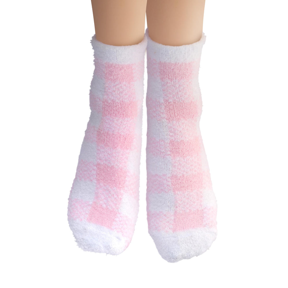 Earth Therapeutics socks worn on feet demonstrating moisturizing treatment in use