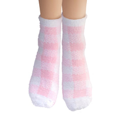 Earth Therapeutics socks worn on feet demonstrating moisturizing treatment in use