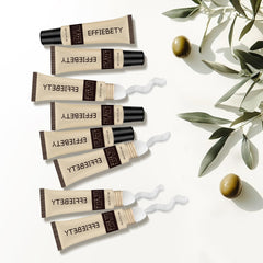 EFFIEBETY ingredient flatlay with shea, olive fruit and vitamin E showcasing natural formulation