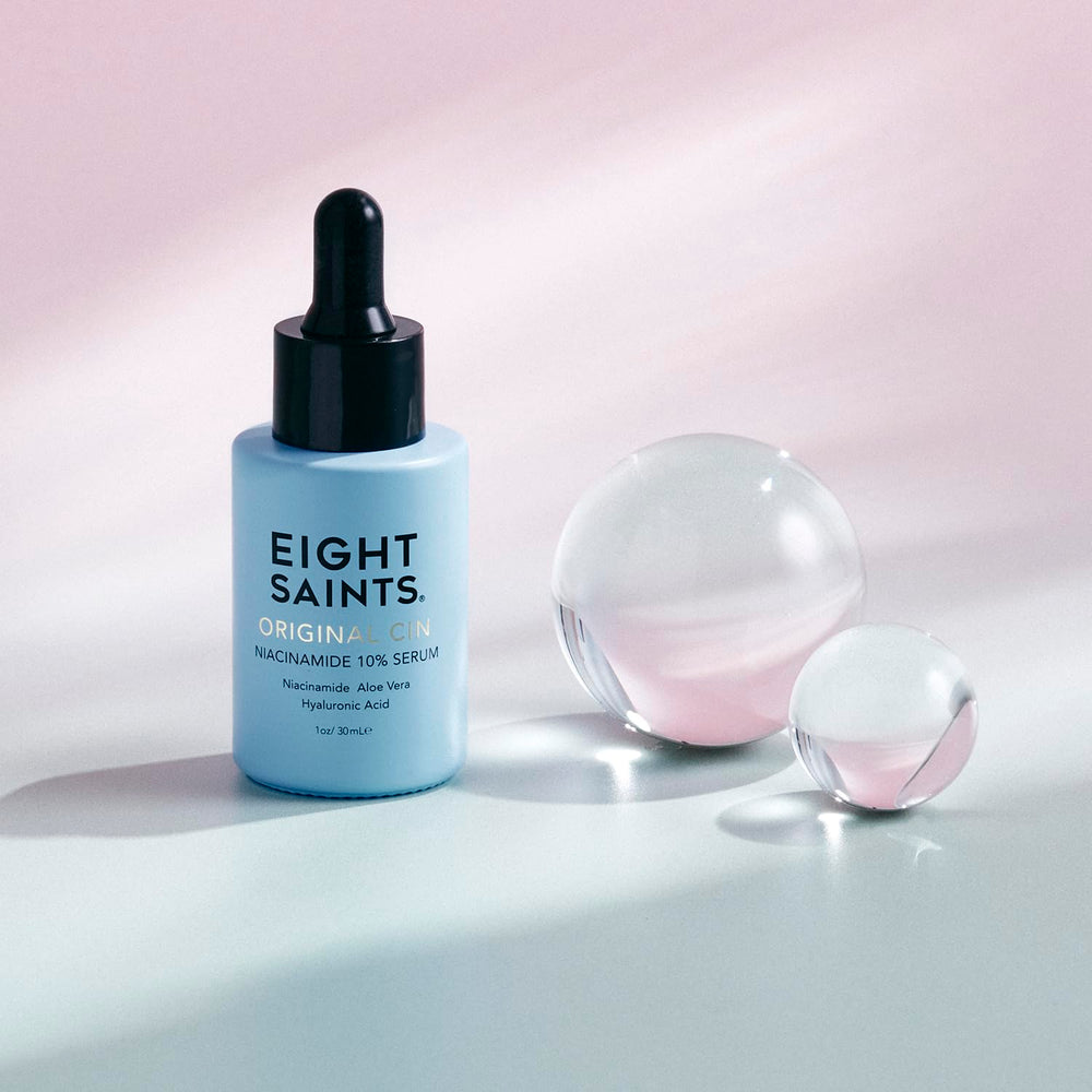 Applying Eight Saints serum to hand demonstrating quick absorption and hydration