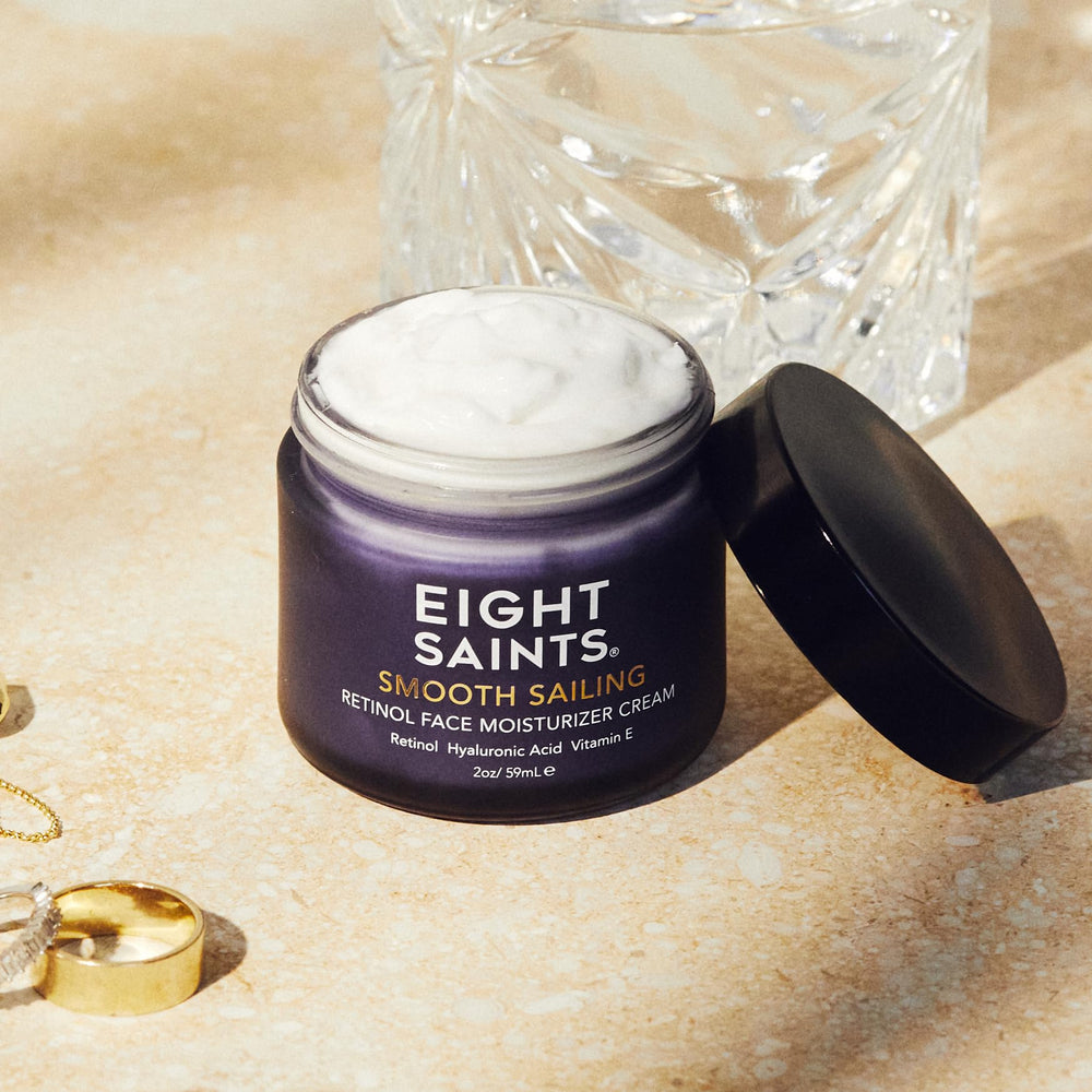 Eight Saints dispensing cream onto fingertip showing controlled pump and amount