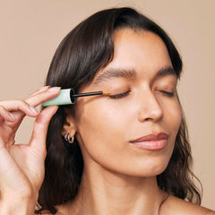 Eight Saints serum droplet on finger highlighting lightweight hydrating texture