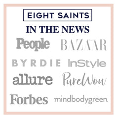 Eight Saints 6.7 oz bottle next to a common item showing travel-friendly size