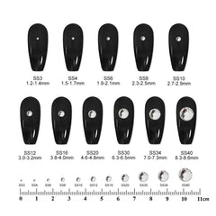 Eleegem stone held on fingertip showing true size and scale