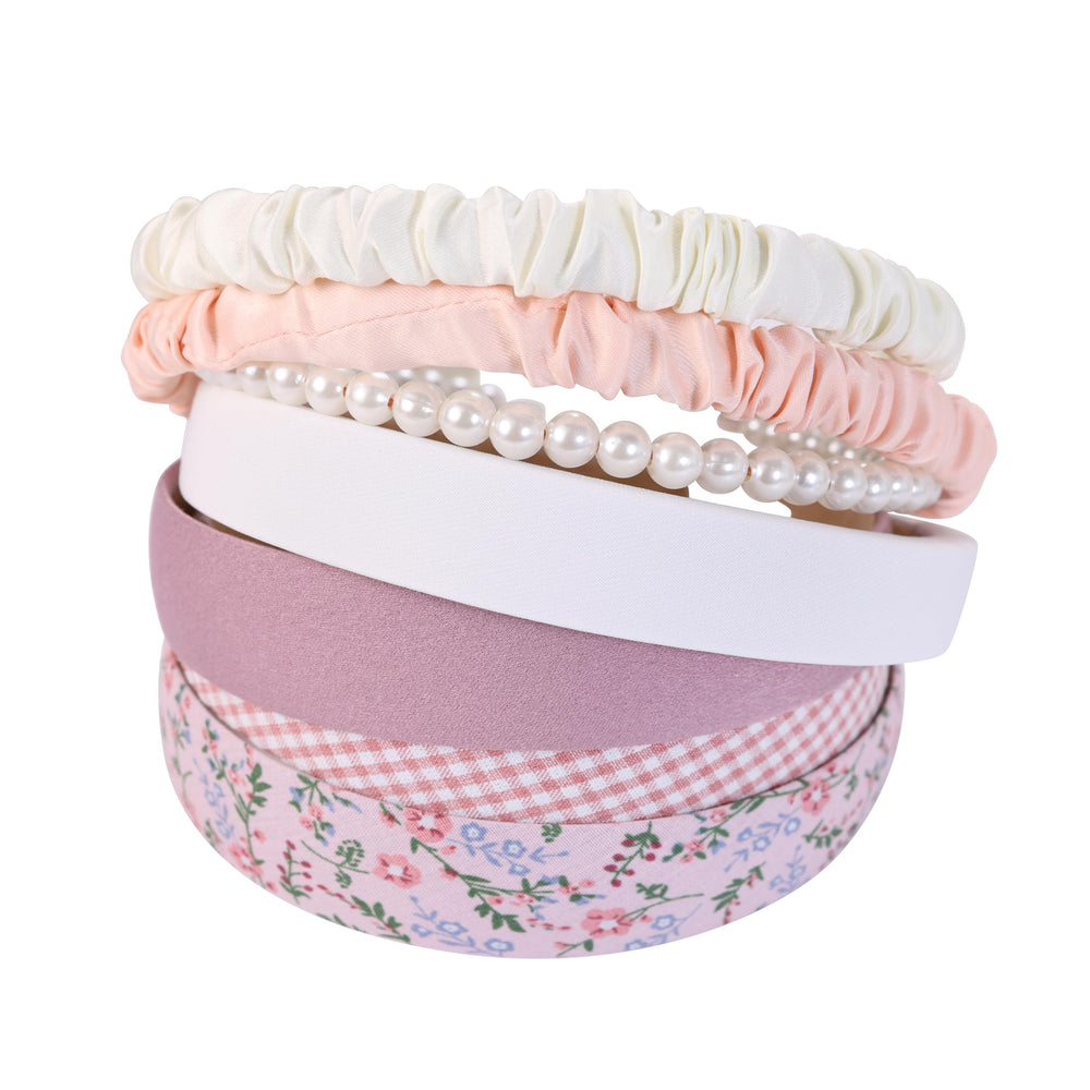 Eleilians floral knot headband on mannequin showcasing elegant pattern and texture