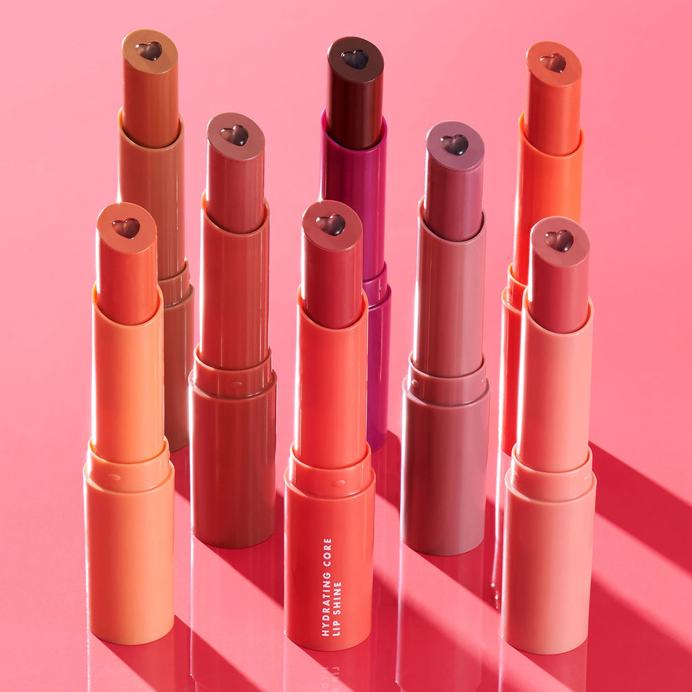 e.l.f. lip shine placed in handbag conveying on-the-go hydration benefit