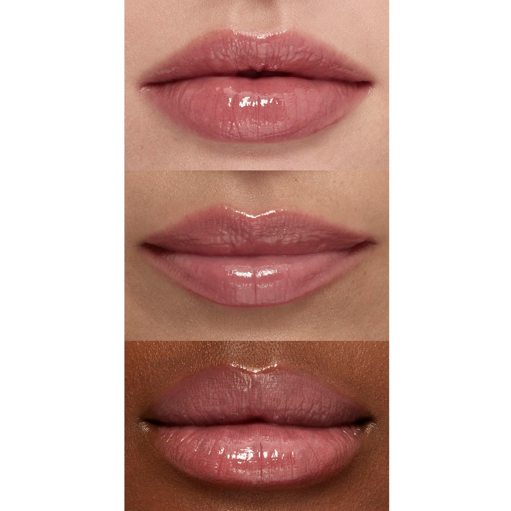 e.l.f. Sun Boss Gloss next to lipstick to show compact size and portability
