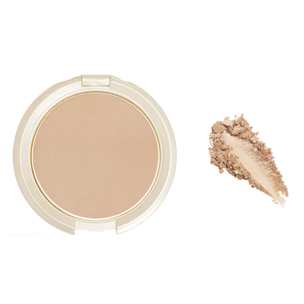 Elizabeth Mott open highlighter pan close-up revealing champagne powder and pearl sheen