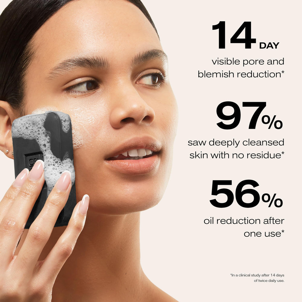 Erno Laszlo cleansing bar held in hand showing compact travel size