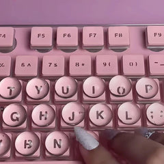 ERRECI keycap next to ruler showing raised 0.15 inch height for ergonomic benefit