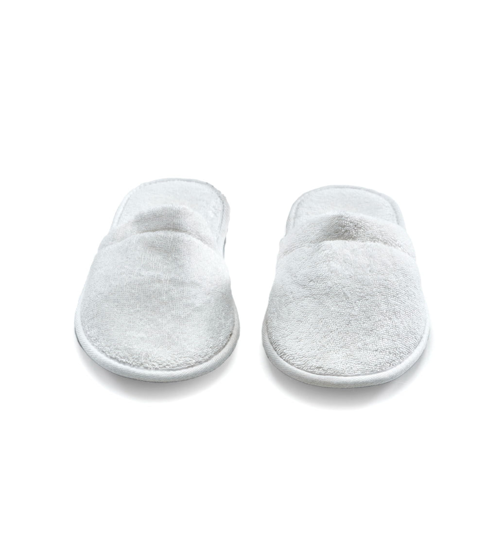 ESKYMODE slipper worn in spa setting demonstrating relaxed, cushioned comfort