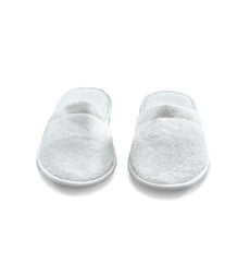 ESKYMODE slipper worn in spa setting demonstrating relaxed, cushioned comfort