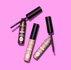 essence tube beside a common object to show compact size for travel-friendly carry