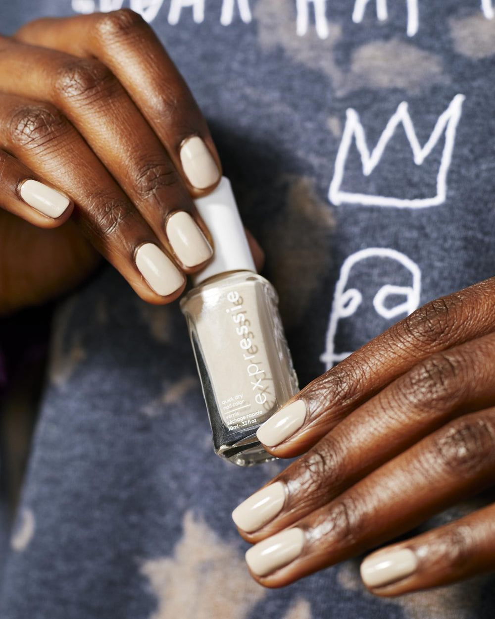 essie lifestyle on desk with manicure tools, fast at-home touch-up benefit