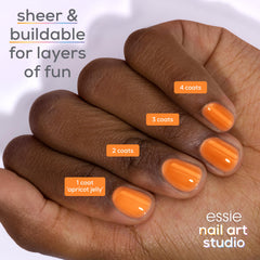 essie single-nail swatch illustrating sheer apricot wash for subtle color