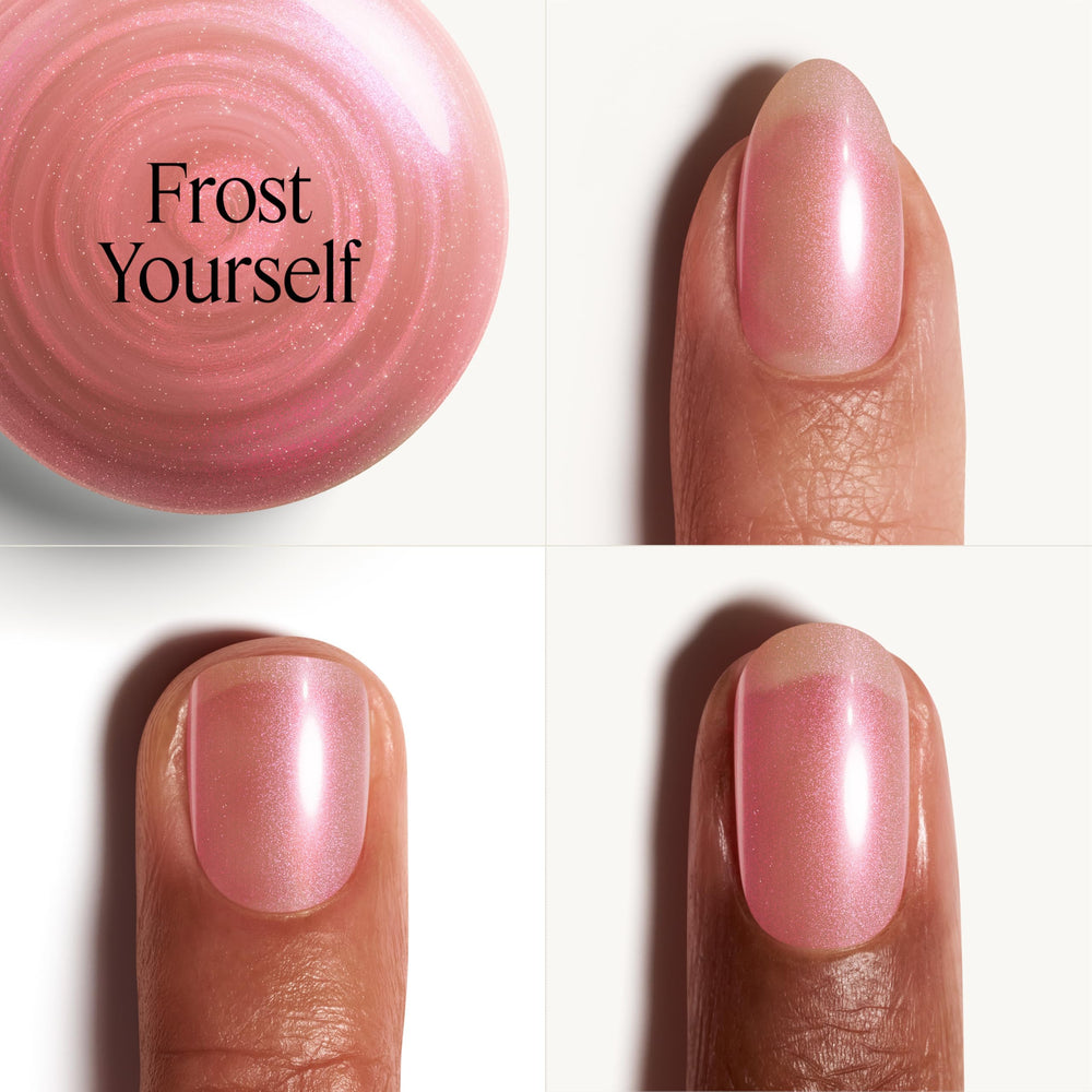 essie hand with nails painted Frost Yourself showing wearable gold-pearl sparkle benefit