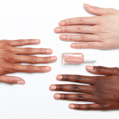 essie polish swatches on fingertips showing true pink-beige shade and quick-dry finish