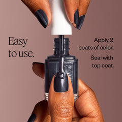 essie hand holding bottle for scale showing compact 0.46 fl oz size benefit: travel-friendly
