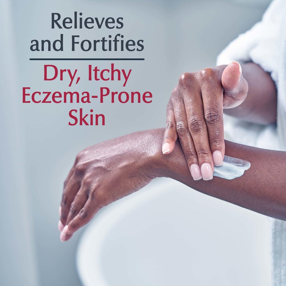 Hand holding Eucerin tube to show scale and portable eczema relief