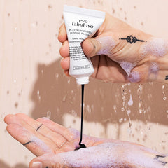 EVO travel bottle held in hand demonstrating compact size and portability