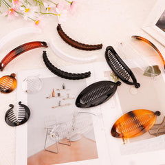 Exacoo clips displayed in hand to show scale and everyday portability
