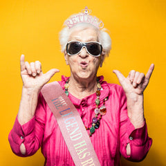Exacoo crown and sash worn by retiree at party creating memorable photos