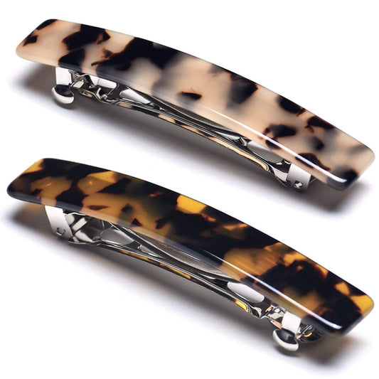 Eyegla front packaging showing two tortoise shell barrettes and neat gift box, elegant presentation