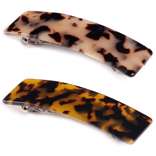 Eyegla front packaging showing two tortoise shell barrettes and gift-ready presentation
