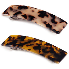 Eyegla front packaging showing two tortoise shell barrettes and gift-ready presentation