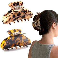 Eyegla large claw front view showing polished tortoise shell and reliable hold