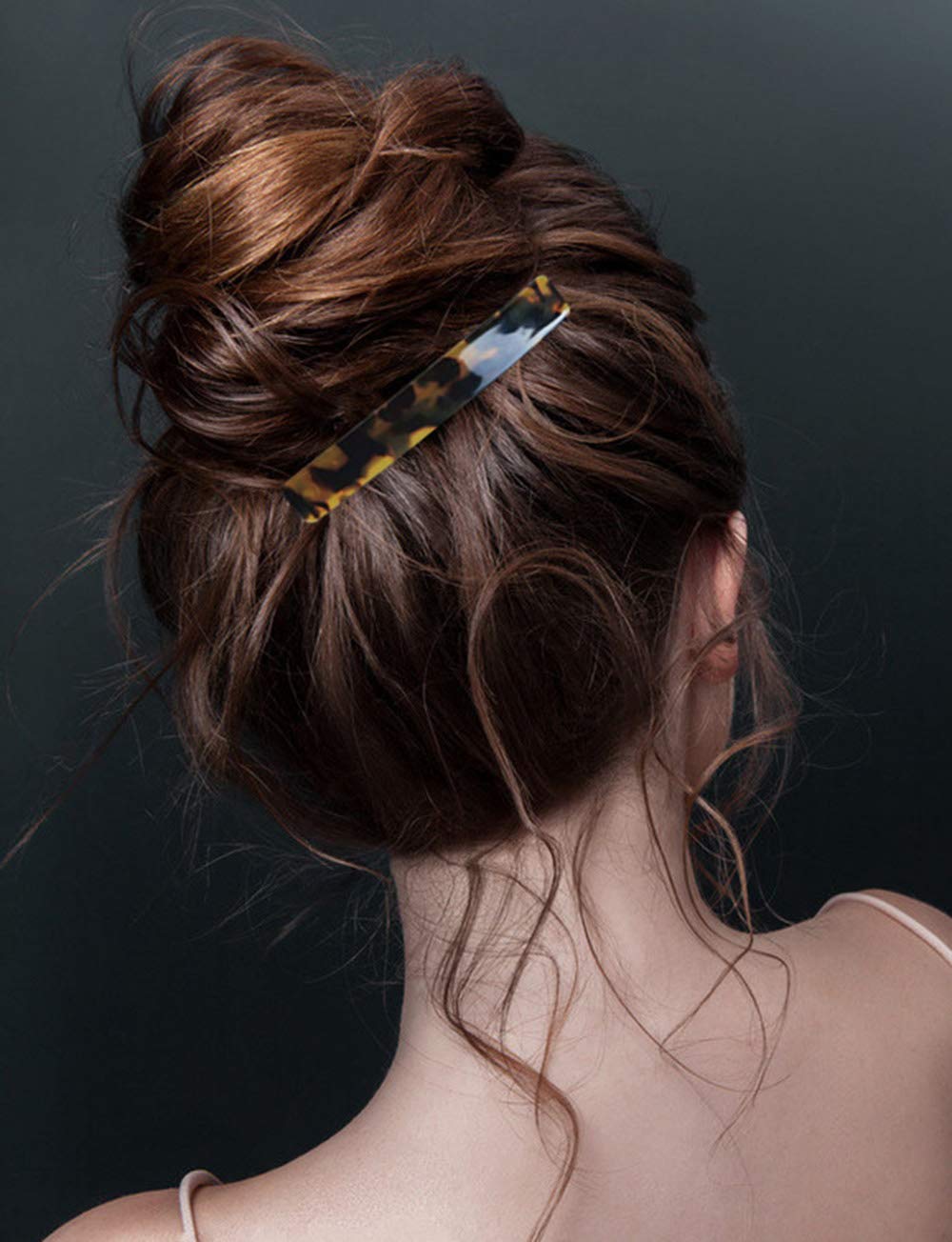 Eyegla lifestyle shot of woman wearing a barrette adding classic, refined style