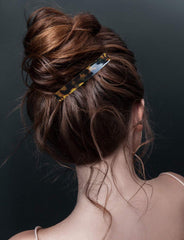 Eyegla lifestyle shot of woman wearing a barrette adding classic, refined style