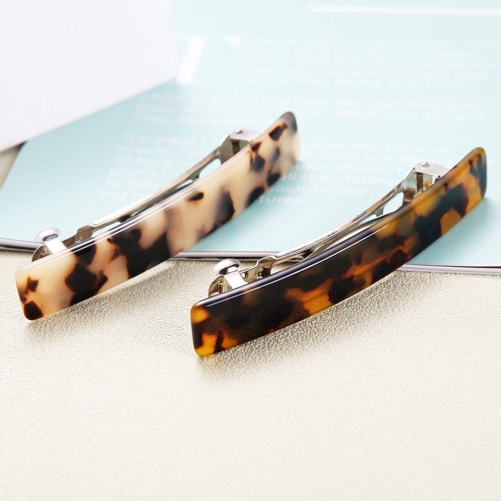 Eyegla barrettes next to ruler showing 3 inch size for accurate scale and fit