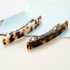 Eyegla barrettes next to ruler showing 3 inch size for accurate scale and fit