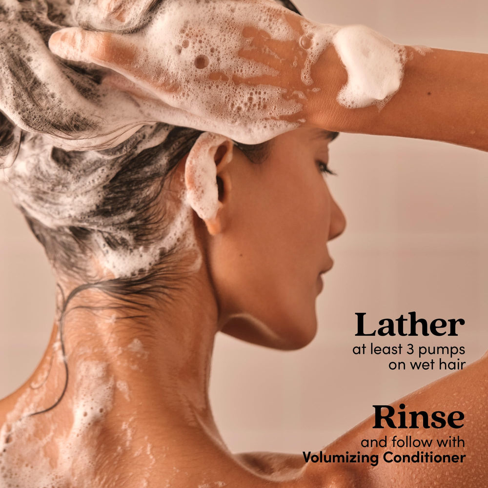 Fable & Mane in hand under shower demonstrating root-focused application