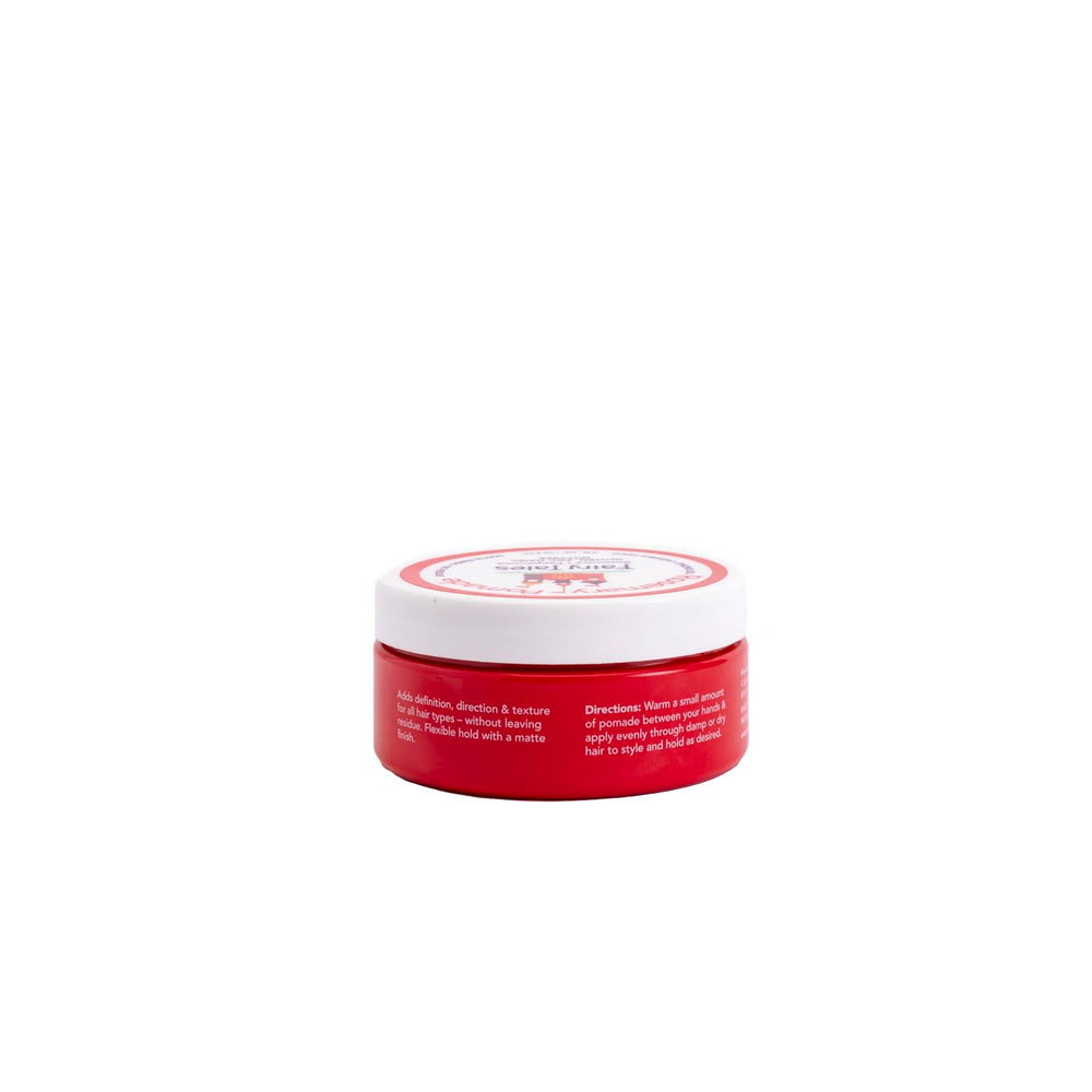 Fairy Tales pomade in adult hand to show 2 oz size and travel-friendly benefit