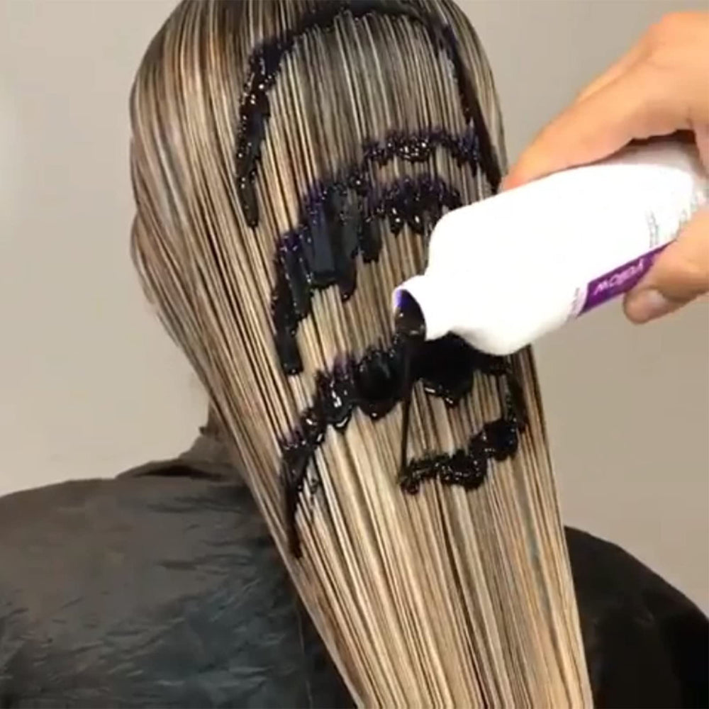 Fanola purple shampoo lather closeup demonstrating toning action