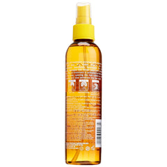 Fantasia PM Night Oil being applied to hair ends demonstrating smoothness and hydration benefit