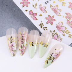 FBABFBUO finished nail mannequin hand showing salon-quality floral manicure